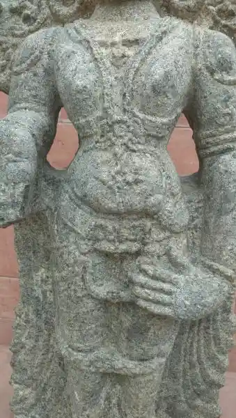 Indian statue, cross and solar disc